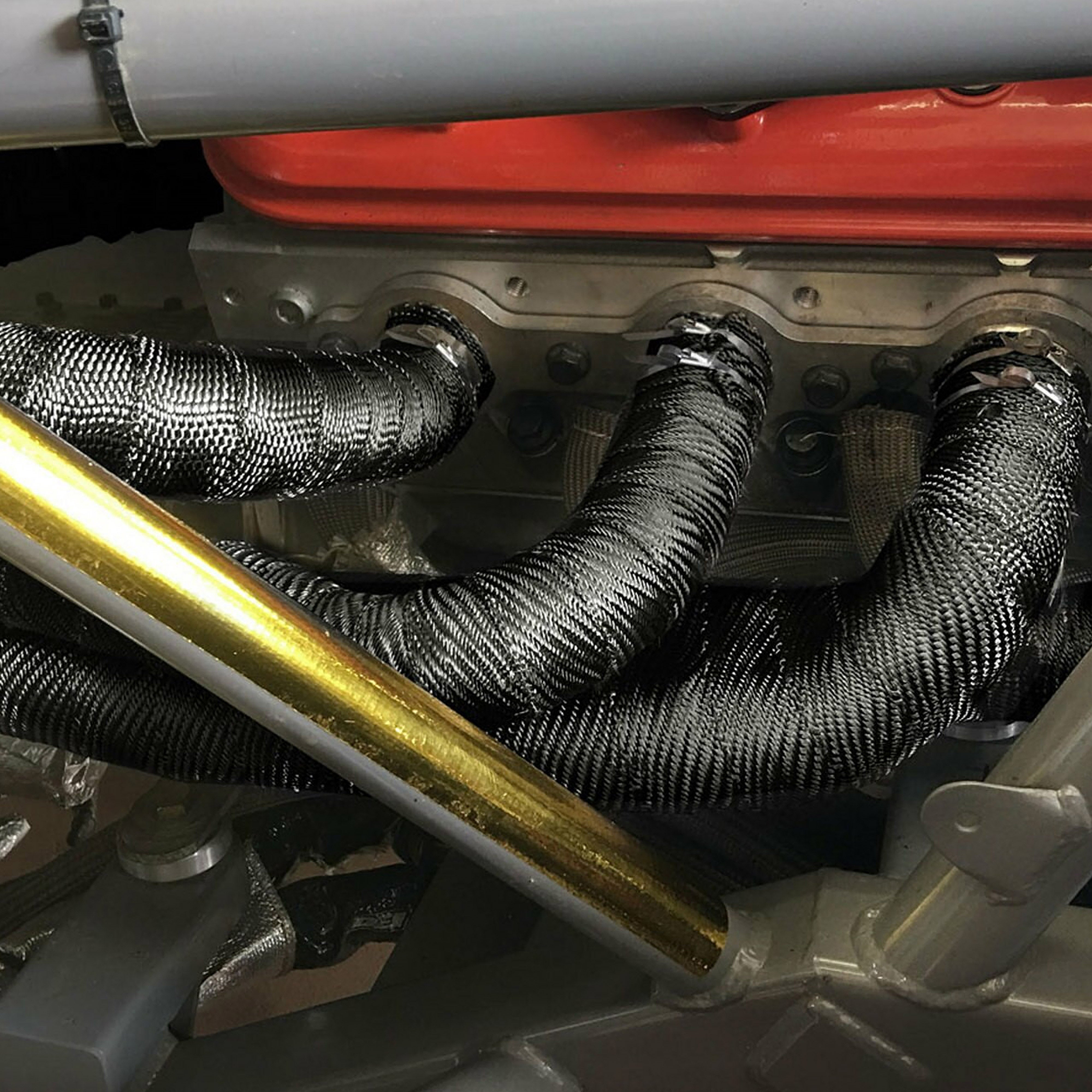 Design Engineering One 100 foot roll of 2 inch wide Black Titanium exhaust wrap. Exhaust Heat Shield