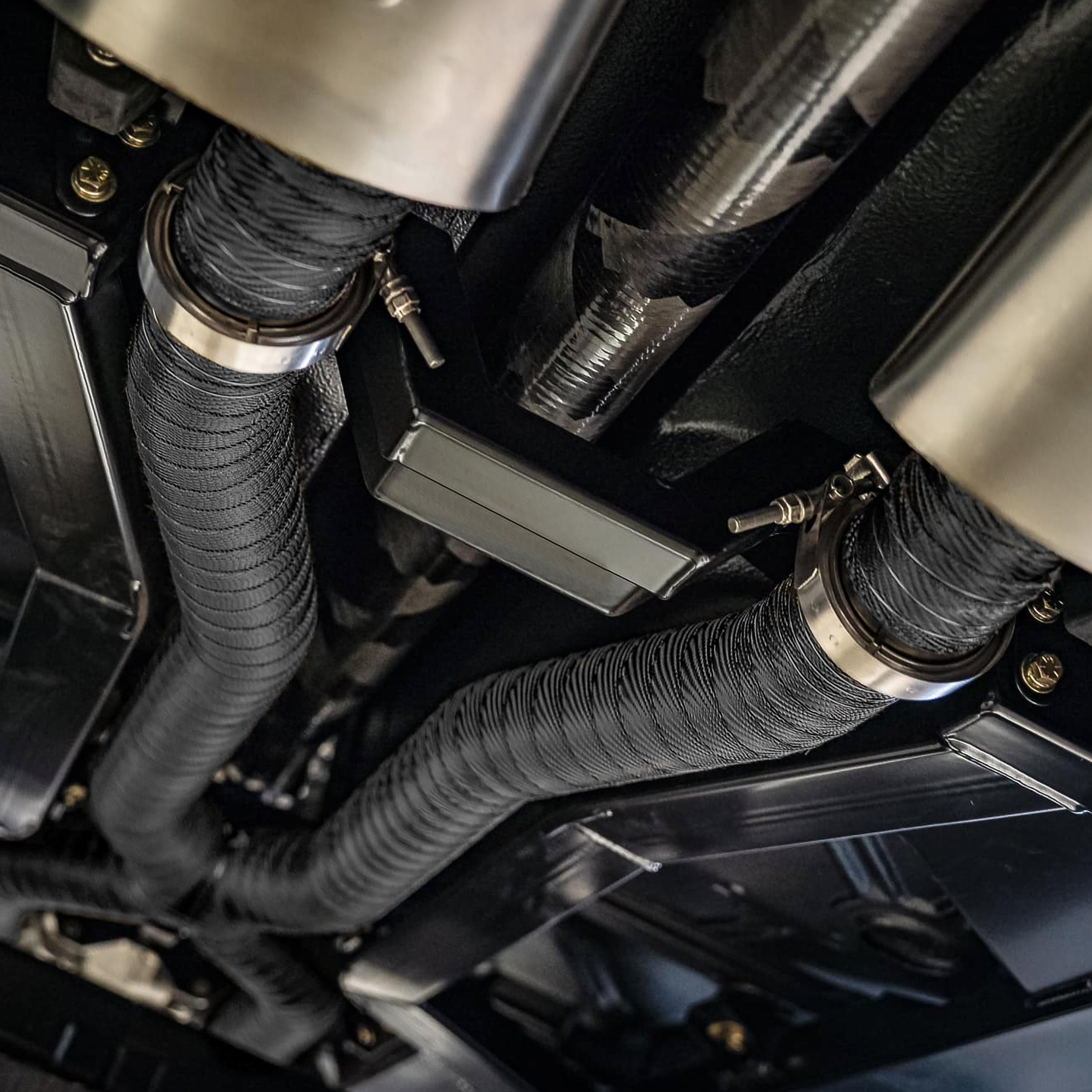 Design Engineering One 25 foot roll of 2 inch wide Black Titanium exhaust wrap. Exhaust Heat Shield
