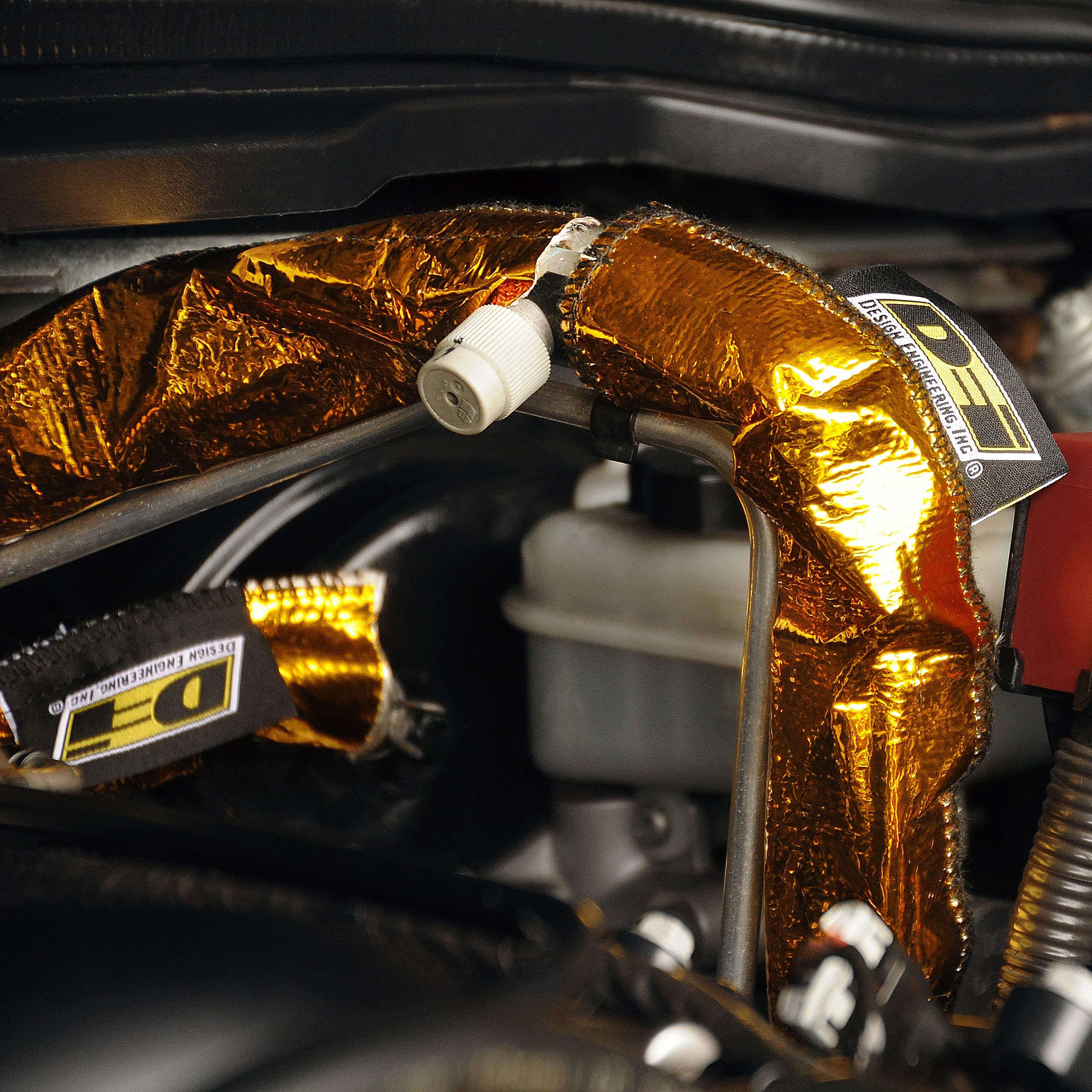 Design Engineering One 36 inch length of Heat Shroud GOLD with a 2 to 2-1/2 inch inside diameter. 10924